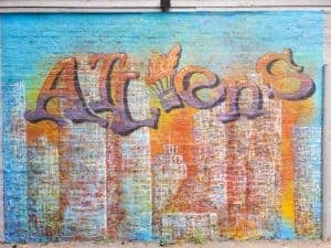 Untitled (purple letters on brick buildings), photo from the city's open data